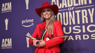 Lainey Wilson, winner of the Entertainer of the Year award, Female Artist of the Year, and Music Event of the Year award for "Save Me,” poses in the press room during the 59th Academy of Country Music Awards at The Ford Center at The Star on May 16, 2024 in Frisco, Texas.